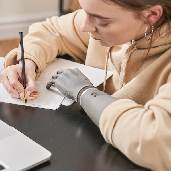 A veteran with a prosthetic arm prepares her career plan