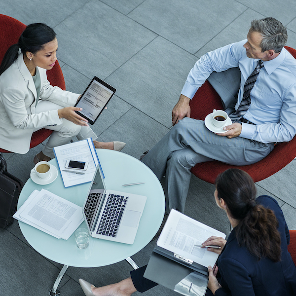 A career counselor meets with local business leaders